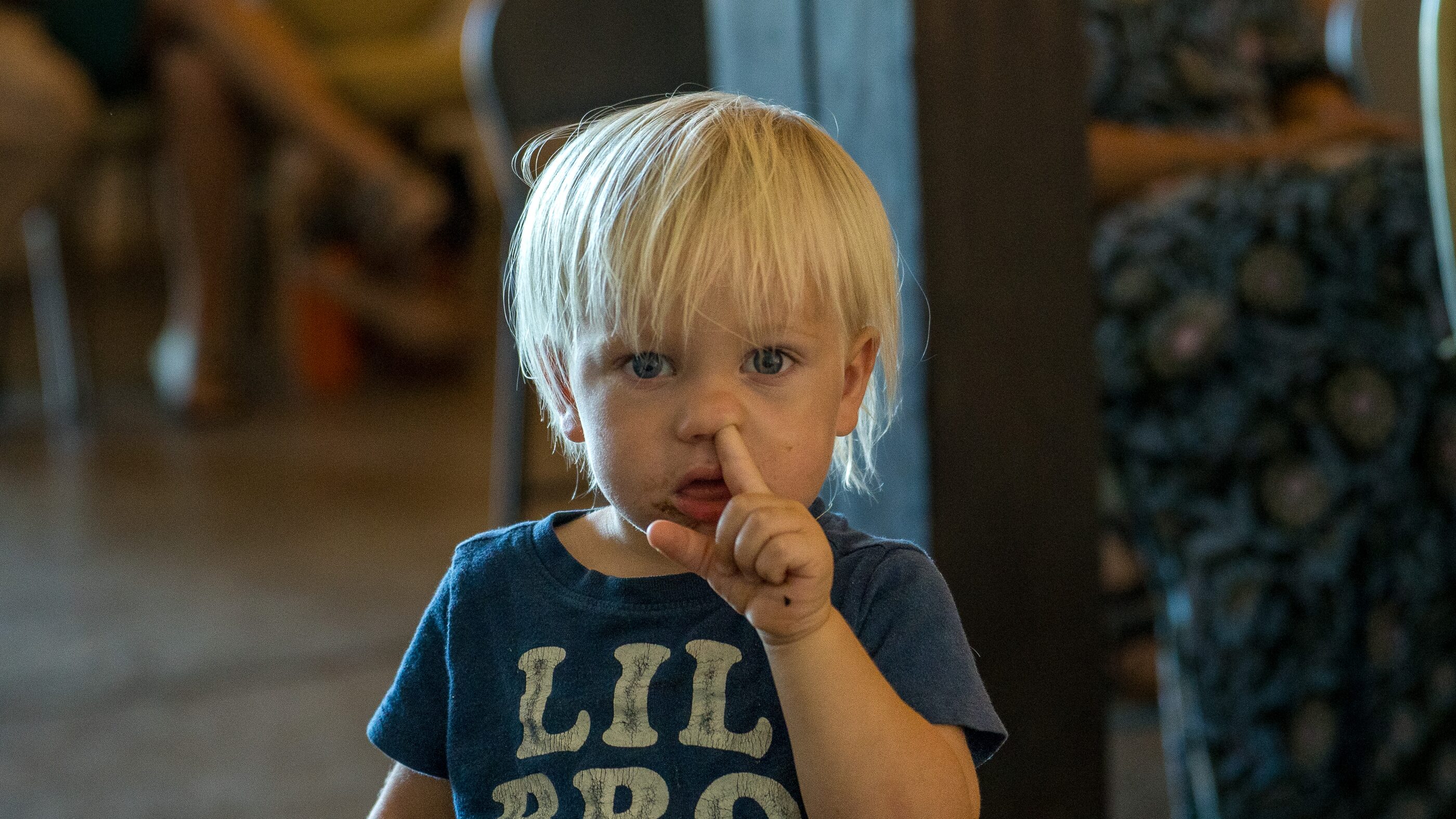 A close portrait of a young child in gentle light